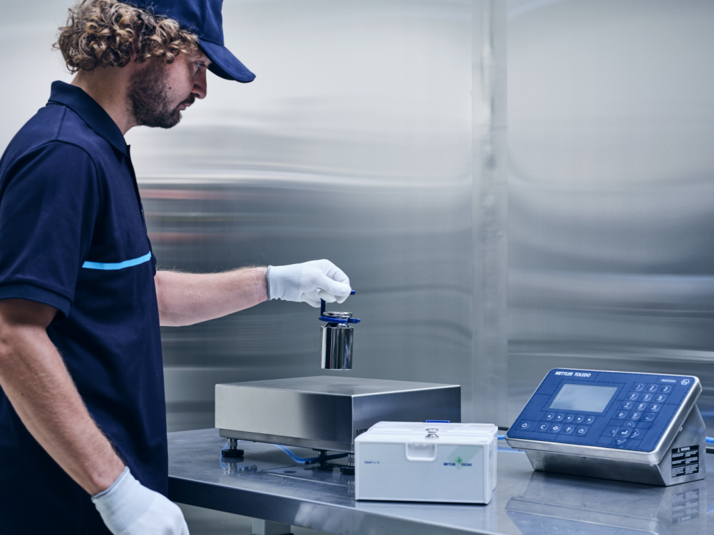 Image of technician providing service on a scale
