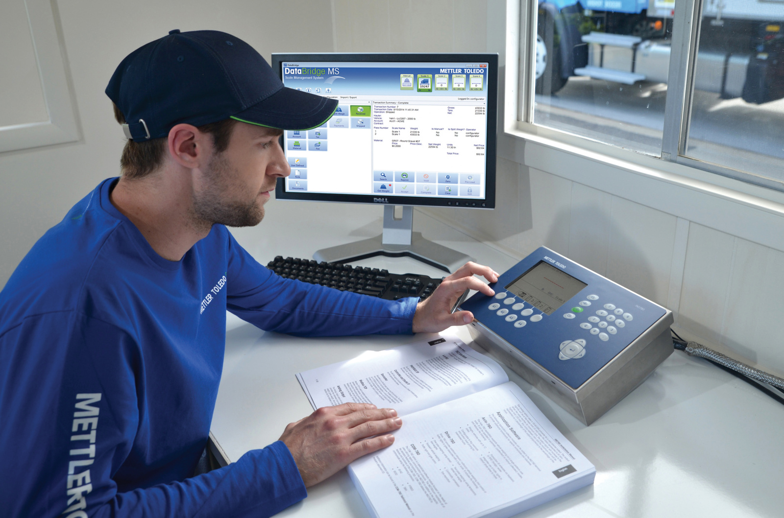 Scale_House_DataBridgeMS_IND780-VI-I-IND-20150811-00039993.JPG Image of technician working on a vehicle scale with DataBridge MS vehicle scale software